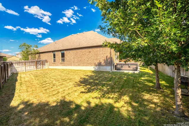 a backyard of a house with lots of green space