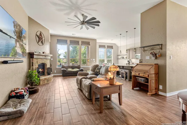 a living room with furniture and a fireplace