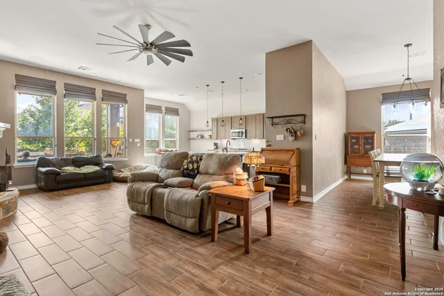 a living room with furniture and a large window