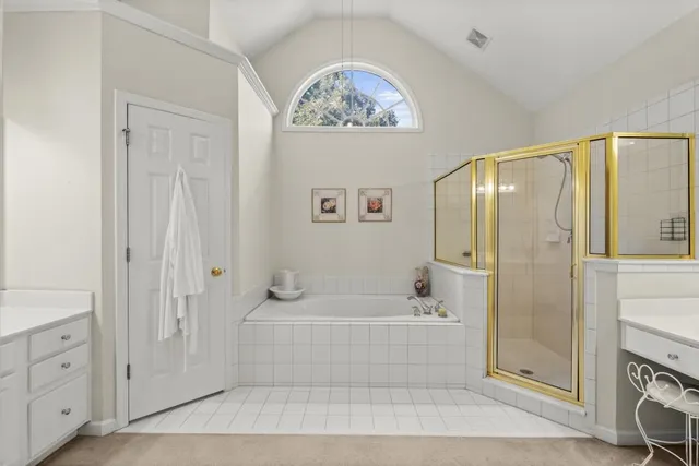 a spacious bathroom with a mirror sink and vanity