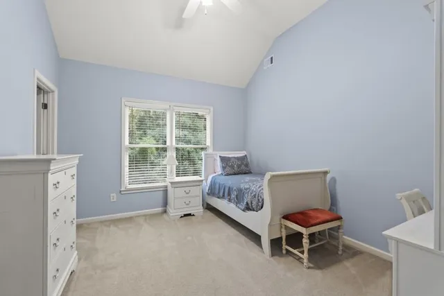 a bedroom with a bed and a cabinets