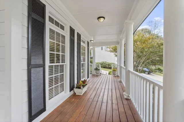 a view of balcony with wooden floor
