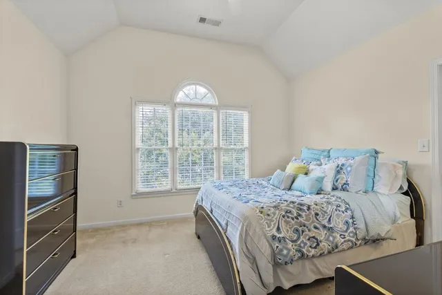 a bathroom with a sink a mirror and shower