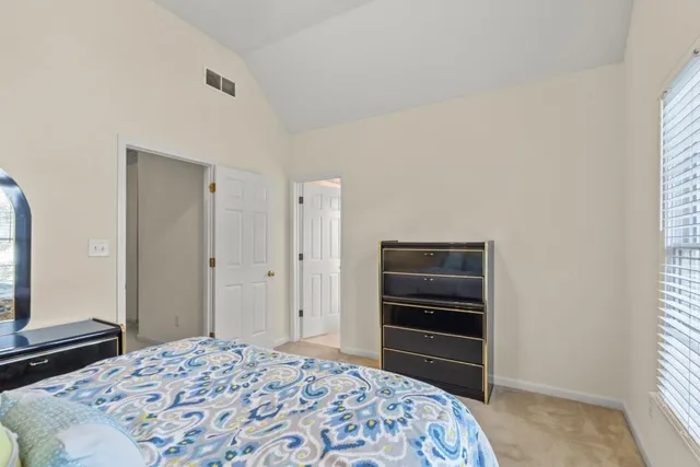 a bathroom with a sink a mirror and a window