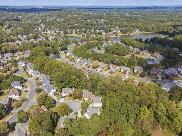 an aerial view of residential houses with outdoor space