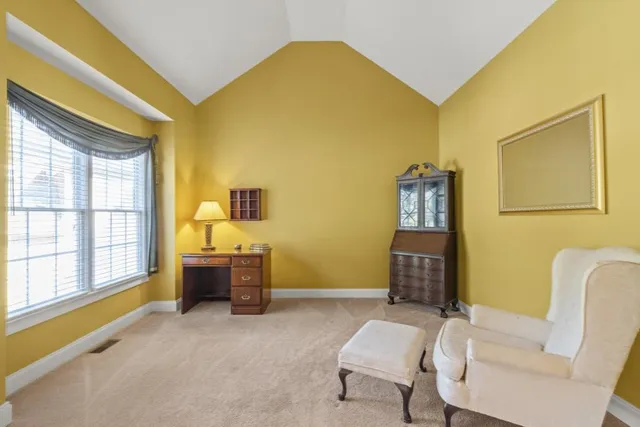 a living room with stainless steel appliances kitchen island granite countertop furniture and a kitchen view