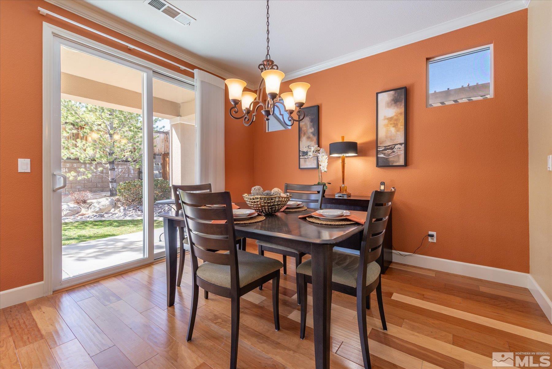 1375 Walking Stick Way Reno, NV 89523 - Photo 12 of 39 a view of a dining room with furniture window and wooden floor