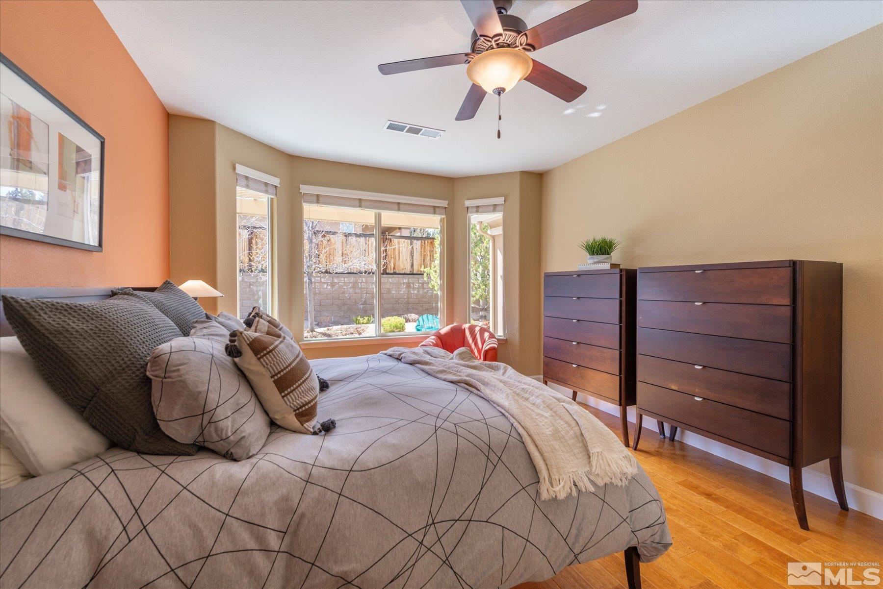 1375 Walking Stick Way Reno, NV 89523 - Photo 16 of 39 a bed room with a bed and a ceiling fan
