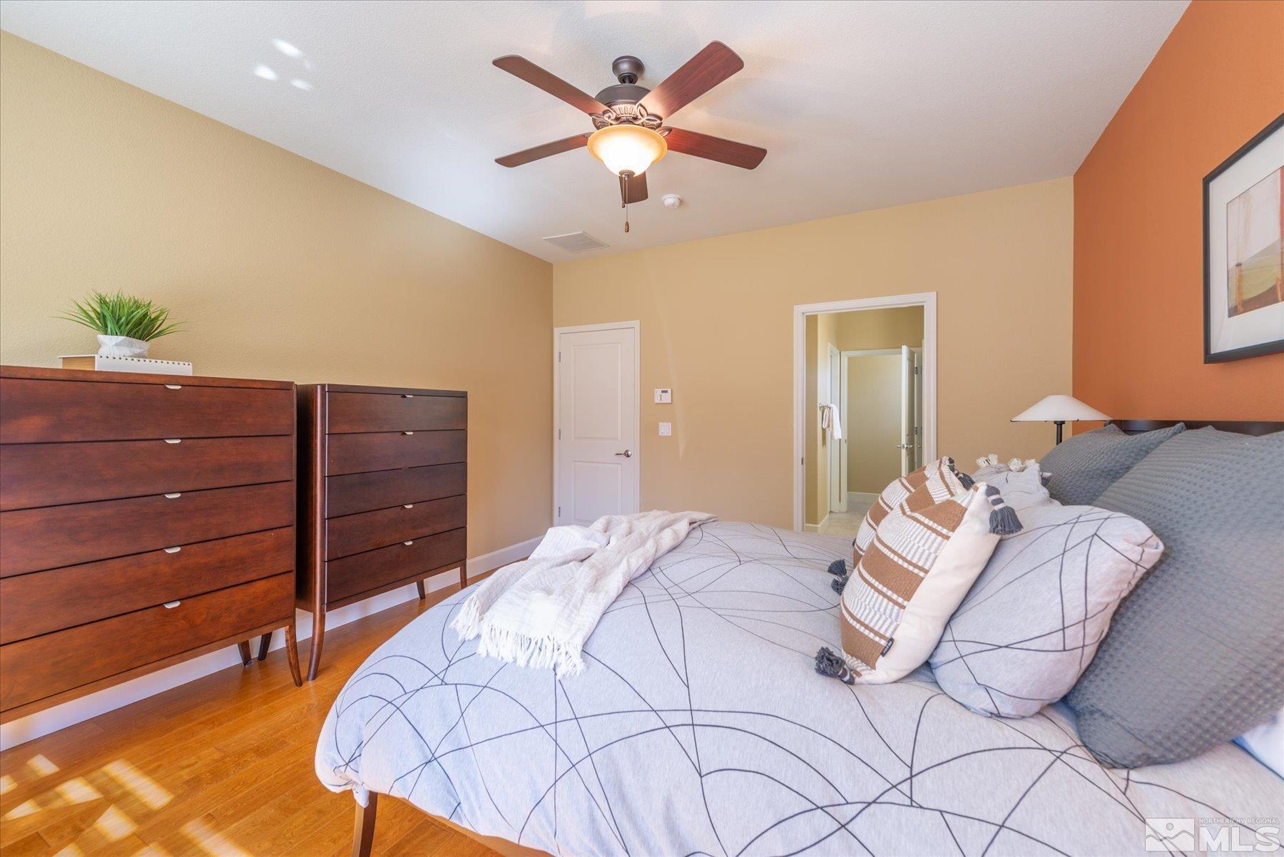 1375 Walking Stick Way Reno, NV 89523 - Photo 17 of 39 a bed room with a bed and a dresser