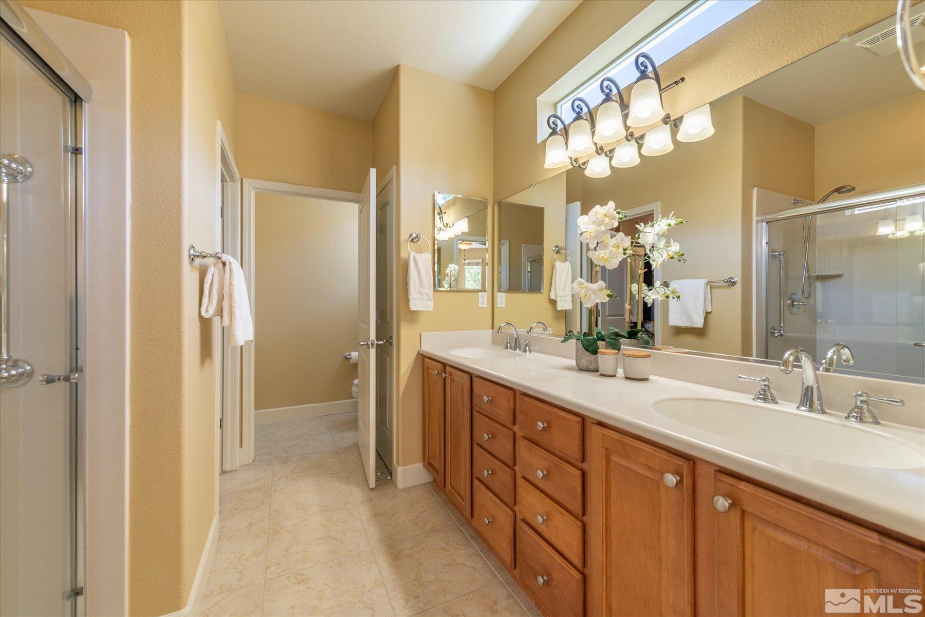 1375 Walking Stick Way Reno, NV 89523 - Photo 18 of 39 a spacious bathroom with a double vanity sink mirror and double