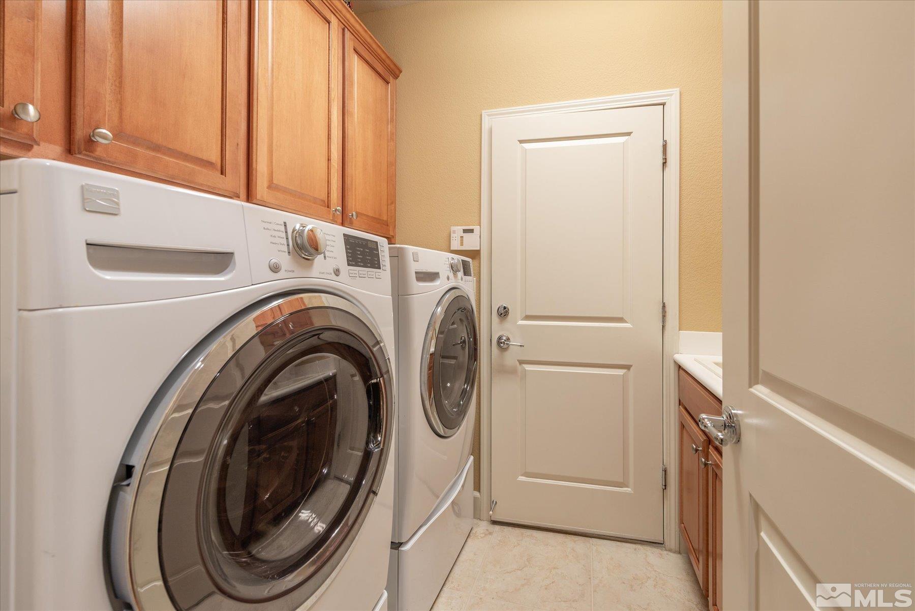 1375 Walking Stick Way Reno, NV 89523 - Photo 24 of 39 a utility room with dryer and washer