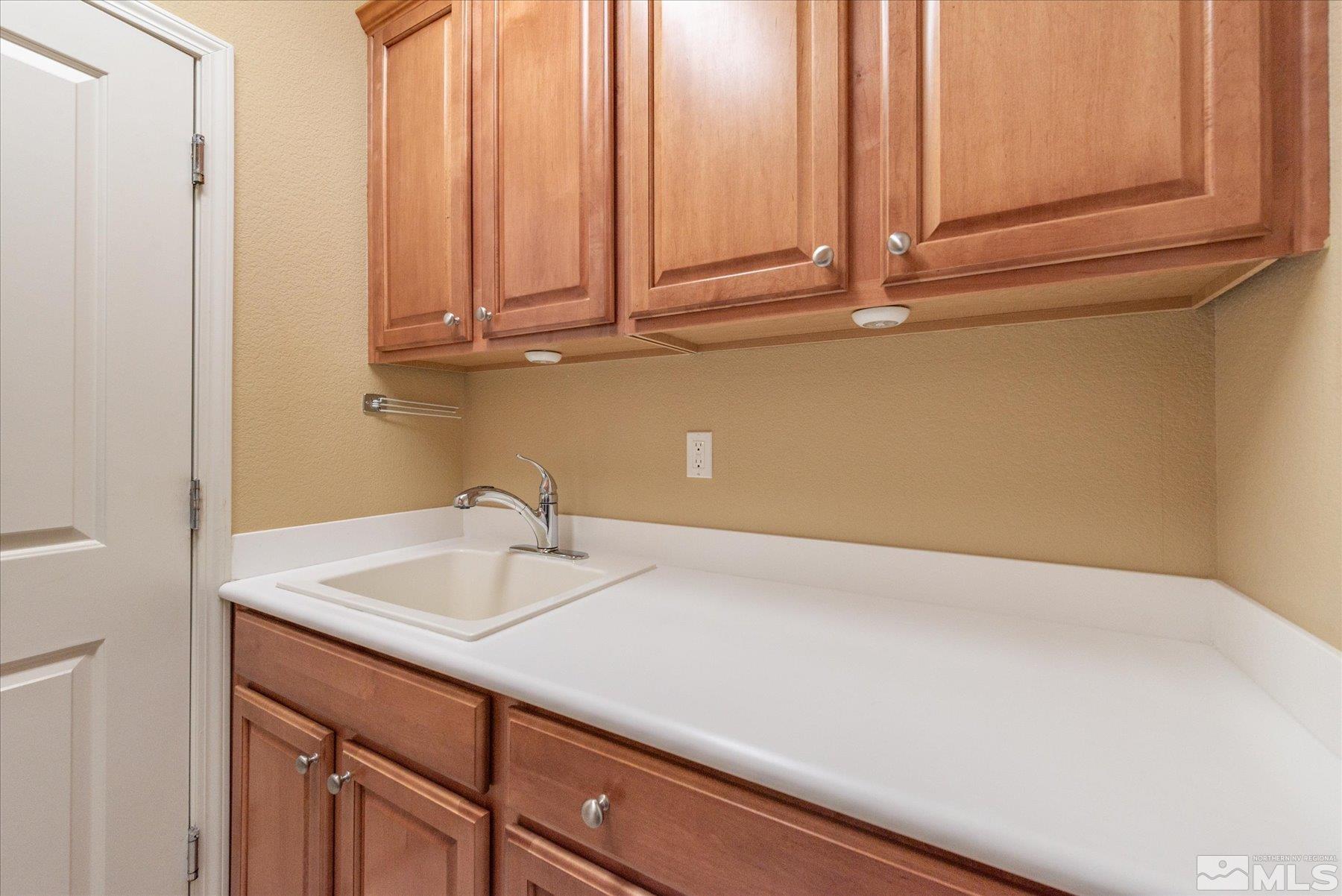 1375 Walking Stick Way Reno, NV 89523 - Photo 25 of 39 a bathroom with a sink and cabinets