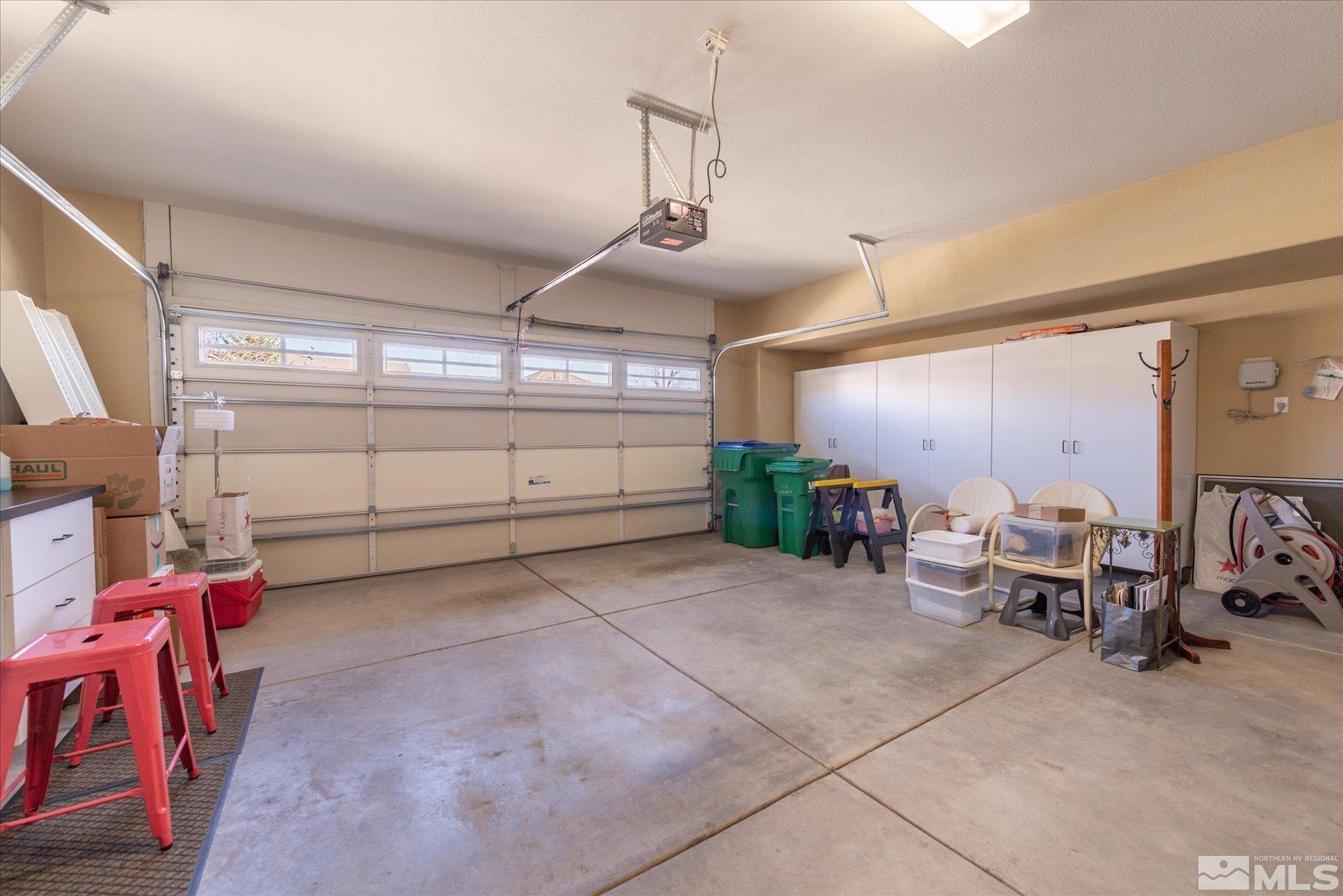 1375 Walking Stick Way Reno, NV 89523 - Photo 26 of 39 a view of a garage with table and chairs