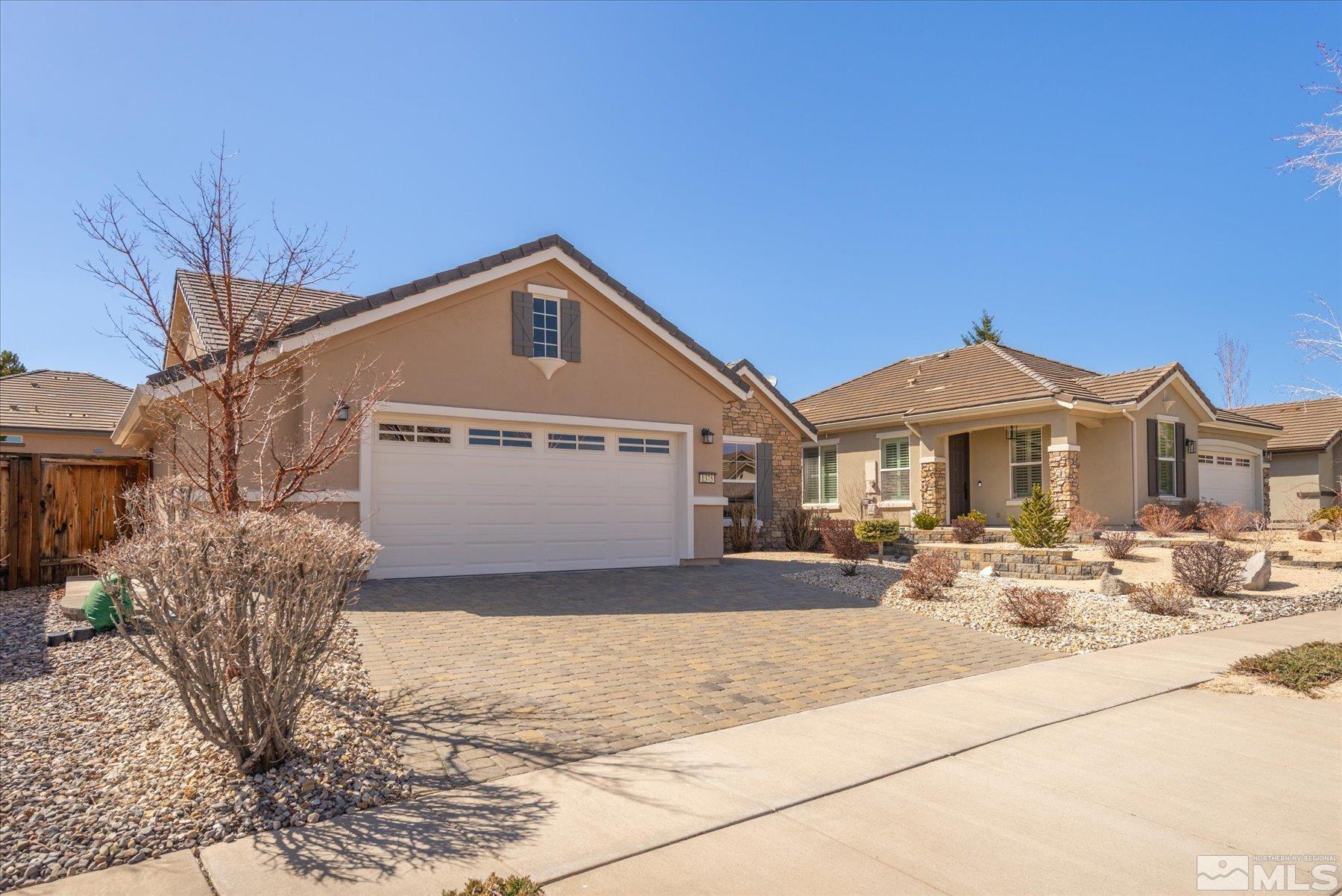 1375 Walking Stick Way Reno, NV 89523 - Photo 3 of 39 a front view of a house with a yard
