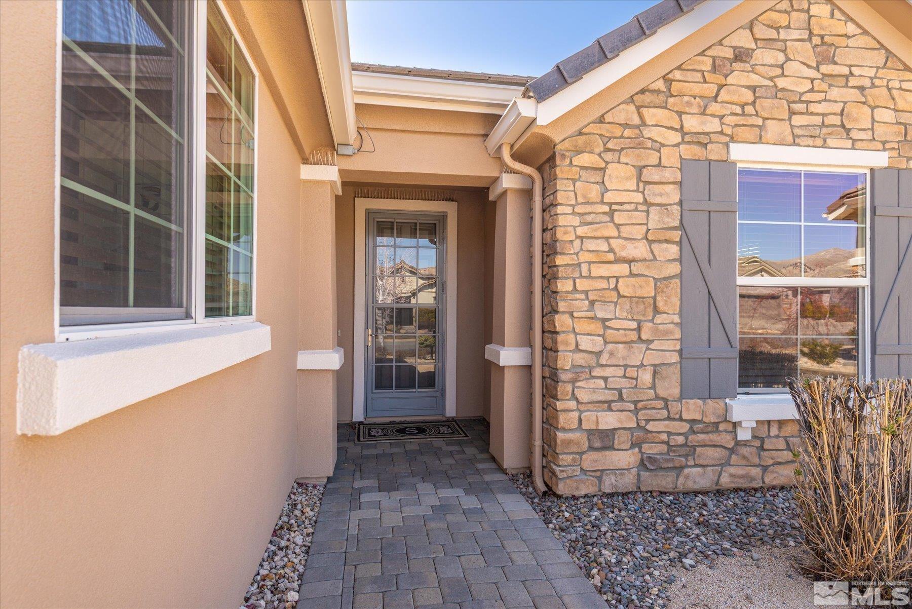 1375 Walking Stick Way Reno, NV 89523 - Photo 4 of 39 a view of front door of house with wooden floor