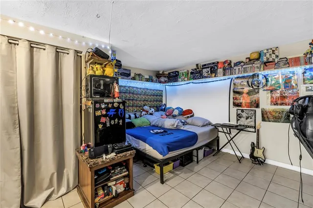 a bedroom with furniture and window