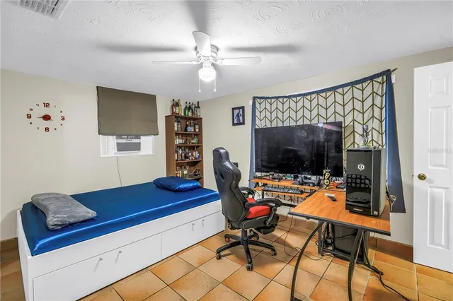 a living room with furniture and a lamp