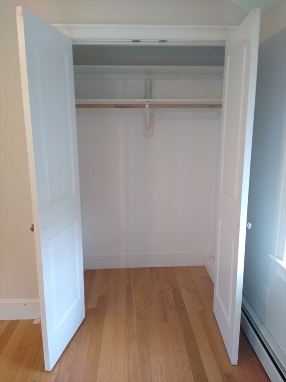 134 Jackson Street Cambridge, MA 02140 - Photo 12 of 22 a view of a room with wooden floor