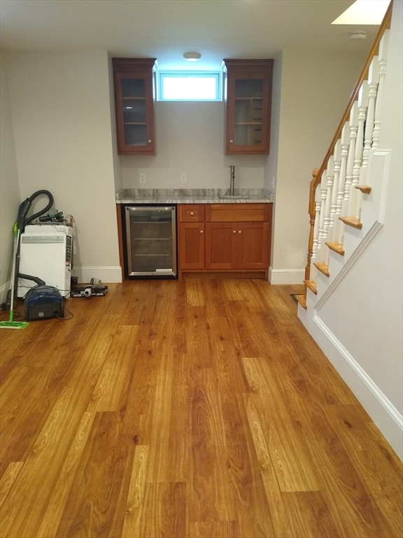 134 Jackson Street Cambridge, MA 02140 - Photo 17 of 22 a view of a room with wooden floor and staircase