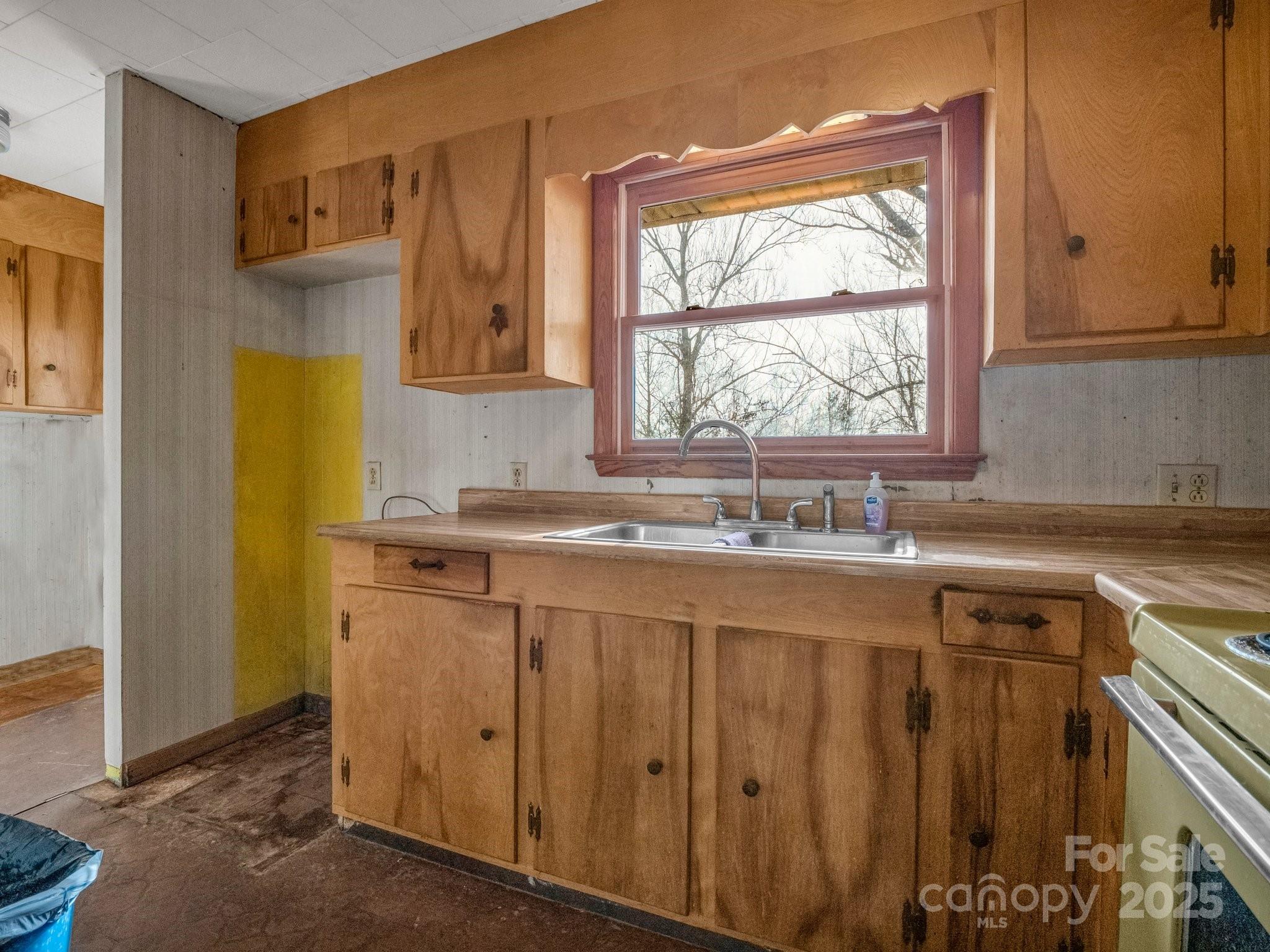 6 Rachel Bell Road Mill Spring, NC 28756 - Photo 12 of 41 a bathroom with a granite countertop sink and a window