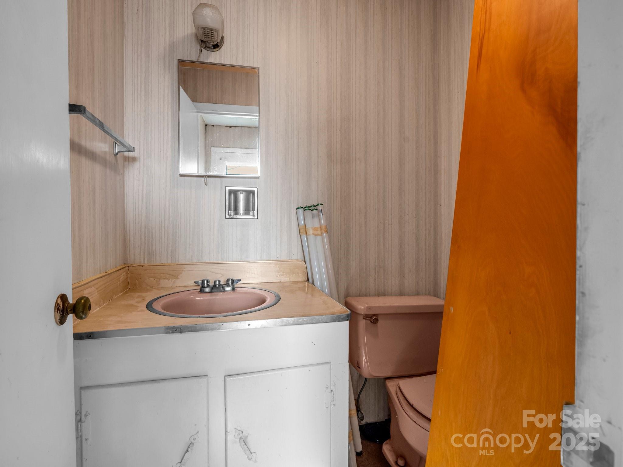 6 Rachel Bell Road Mill Spring, NC 28756 - Photo 14 of 41 a bathroom with a sink and a mirror