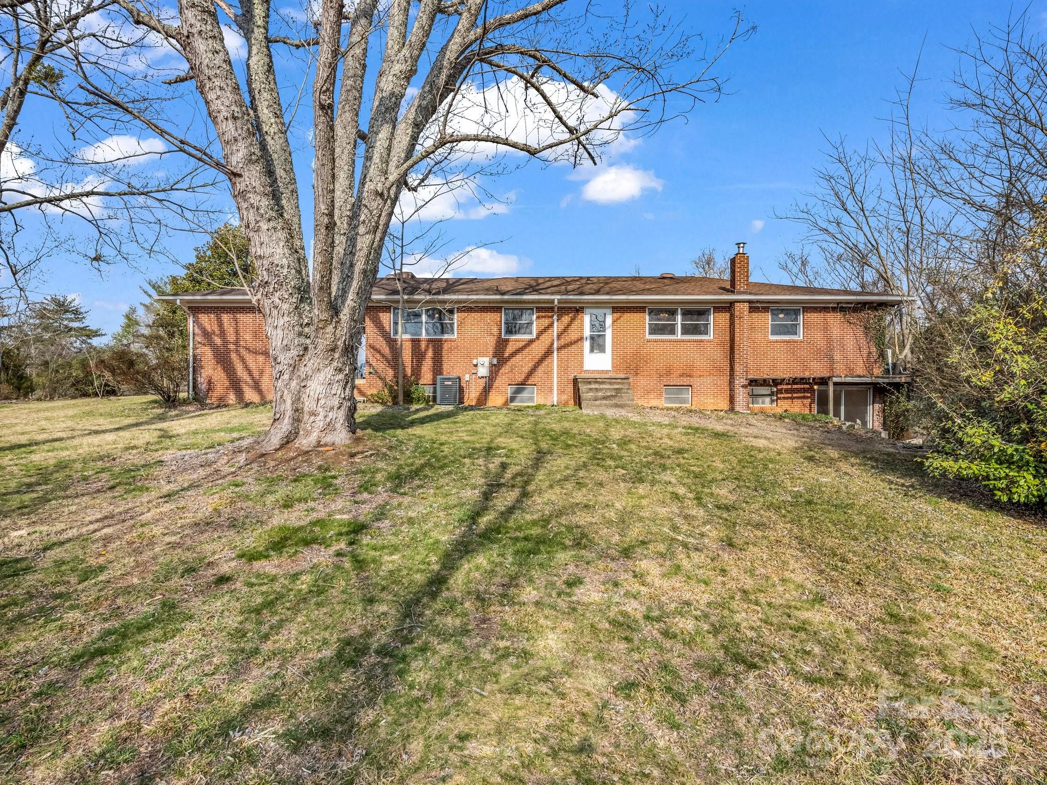6 Rachel Bell Road Mill Spring, NC 28756 - Photo 5 of 41 a view of front of a house with a yard