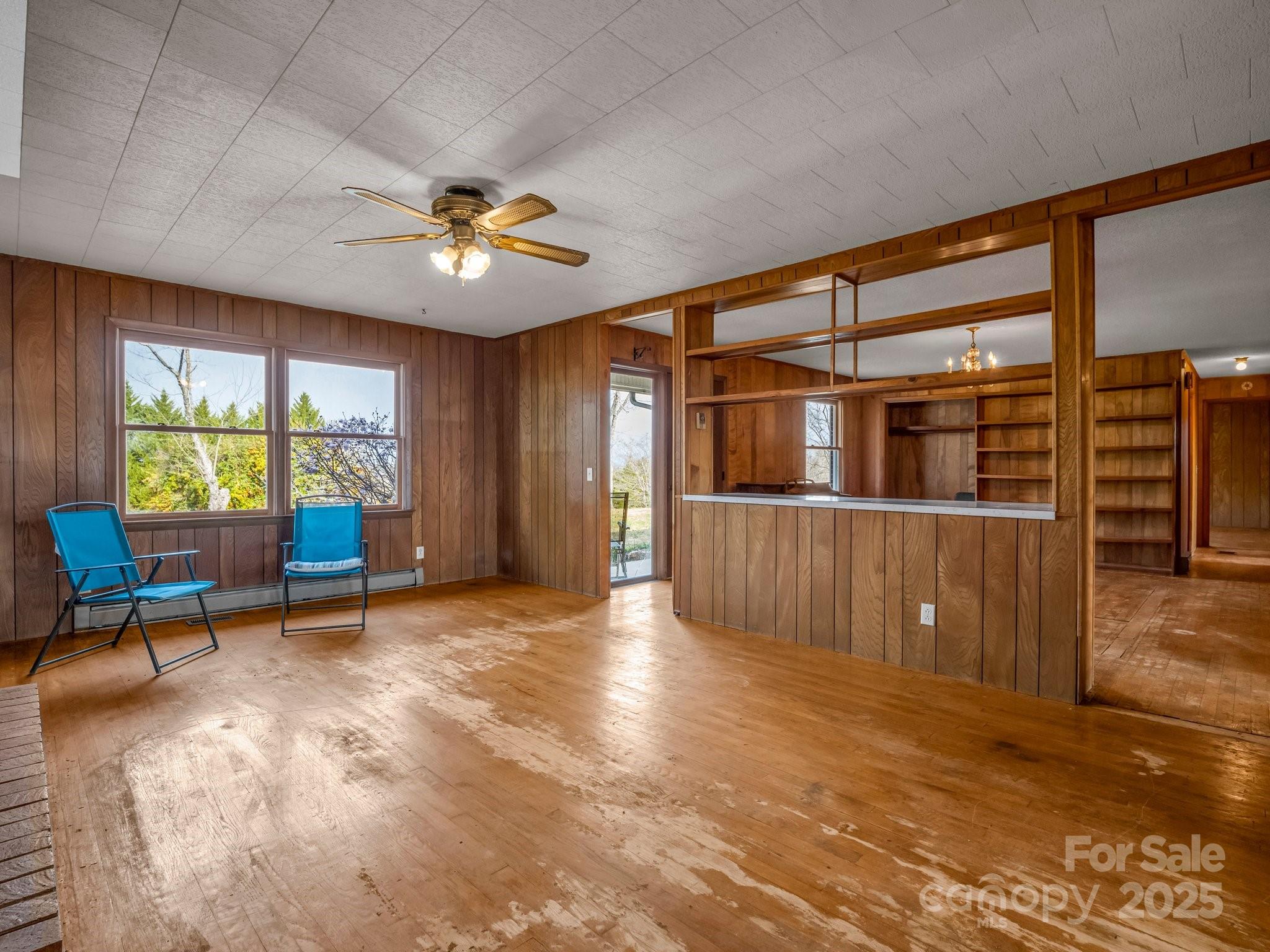 6 Rachel Bell Road Mill Spring, NC 28756 - Photo 8 of 41 wooden floor in an empty room with a window