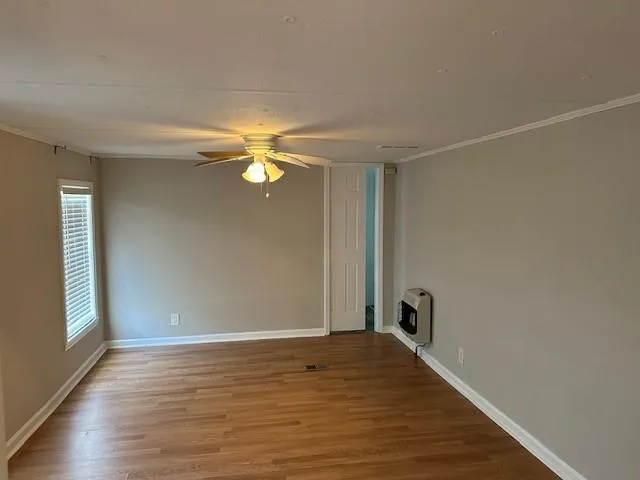 a view of a livingroom with wooden floor