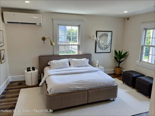 a bedroom with bed and window