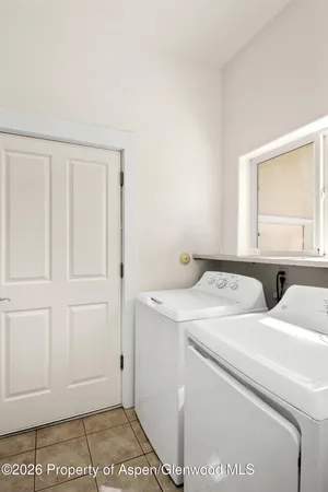 a view of storage and utility room with washer and dryer