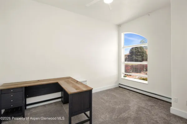 a view of an empty room and window