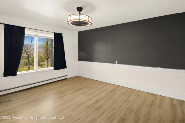a view of an empty room with windows