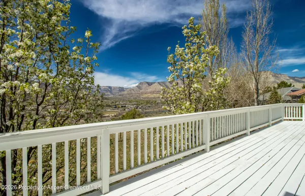 a view of balcony with wooden floor