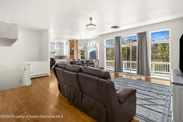 a living room with furniture and a large window