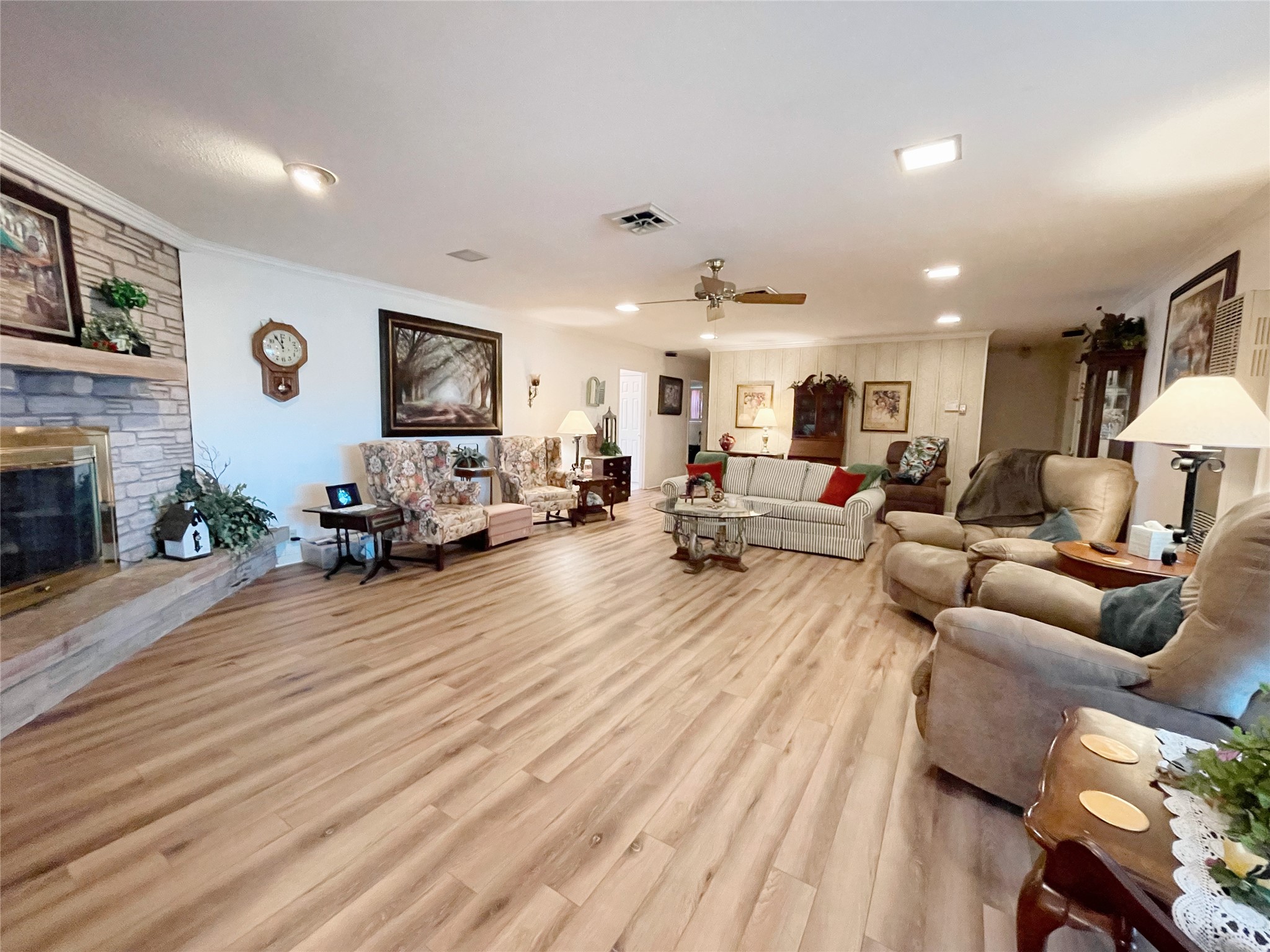 700 Shanklin Road Belton, TX 76513 - Photo 11 of 33 a living room with furniture kitchen view and a fireplace