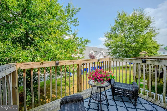 a view of a chair and table on the roof deck