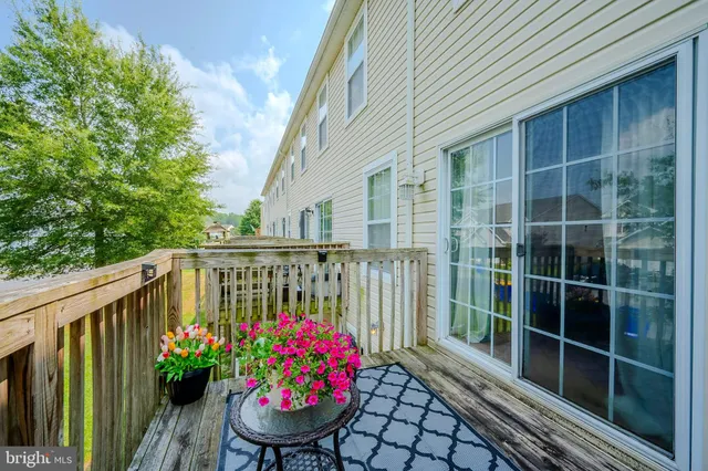 a view of a chair and table on the roof deck