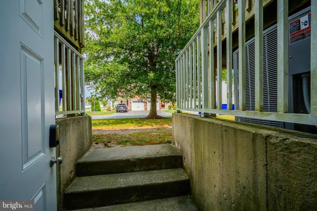 a view of a house with pool and yard