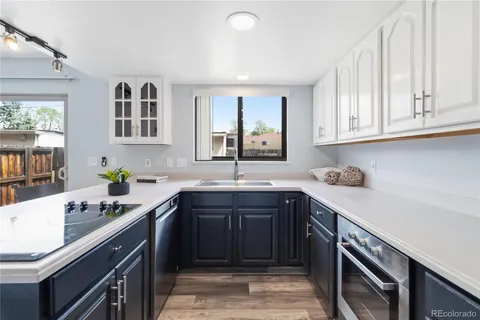 a kitchen with a sink and cabinets
