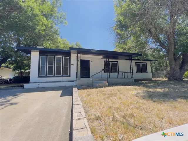 front view of a house with a patio
