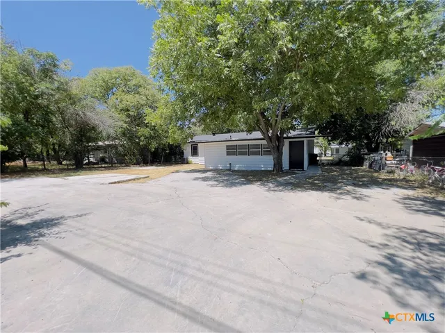 a view of a couches with wooden fence