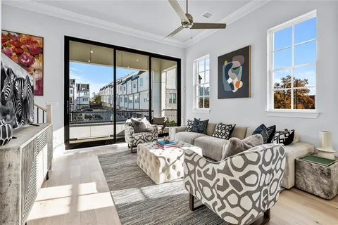 a living room with furniture and a rug