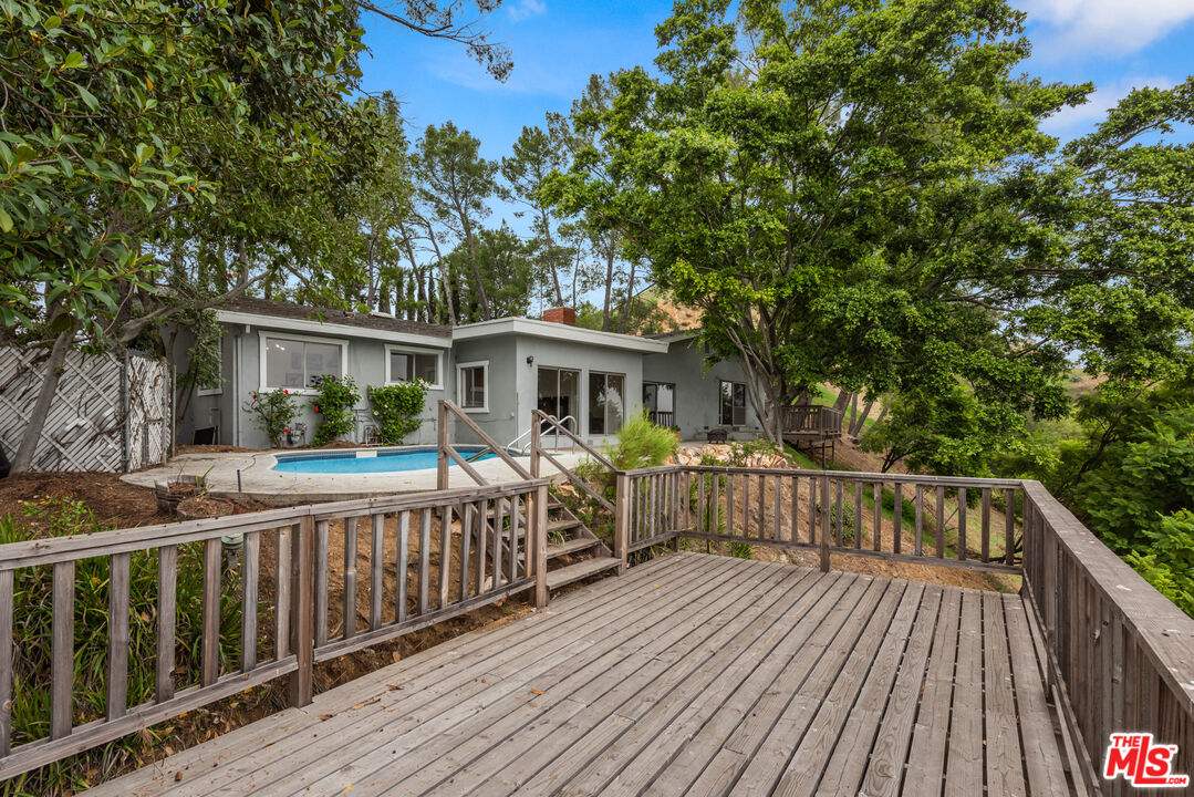 2526 Briarcrest Road Beverly Hills, CA 90210 - Photo 2 of 15 a view of a house with wooden deck