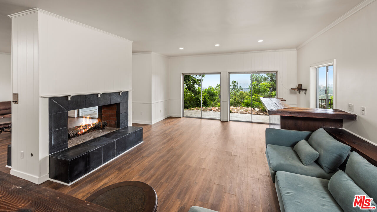 2526 Briarcrest Road Beverly Hills, CA 90210 - Photo 5 of 15 a living room with furniture and a flat screen tv