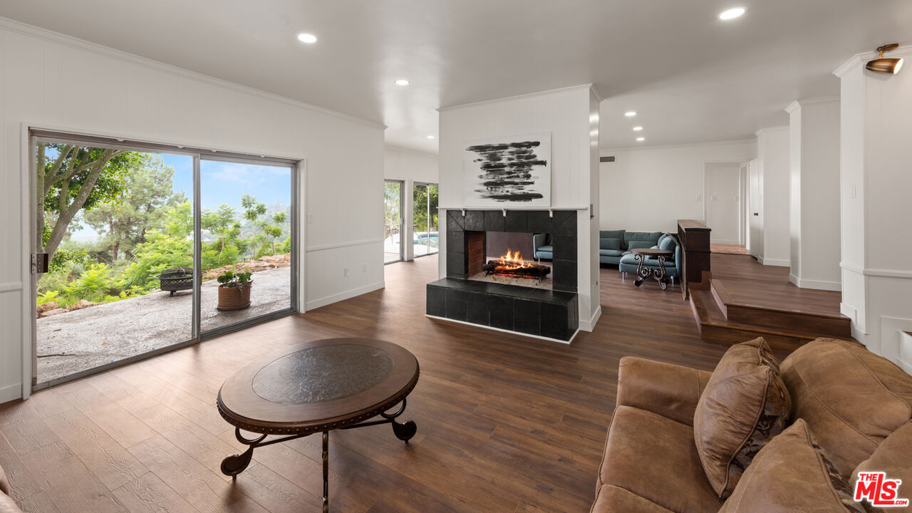 2526 Briarcrest Road Beverly Hills, CA 90210 - Photo 6 of 15 a living room with furniture and a fireplace