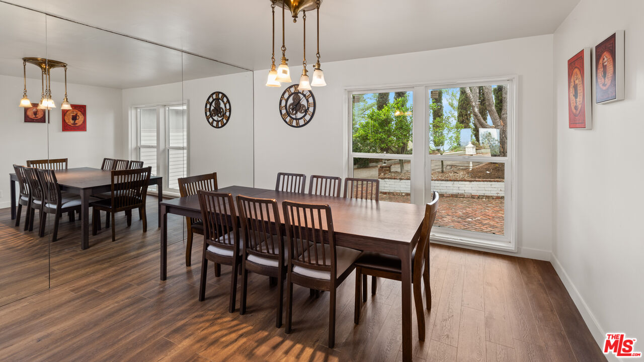 2526 Briarcrest Road Beverly Hills, CA 90210 - Photo 9 of 15 a view of a dining room with furniture window and wooden floor