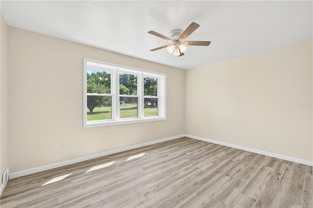 545 Vanderbilt Road Connellsville, PA 15425 - Photo 17 of 49 a view of a room with wooden floor and windows