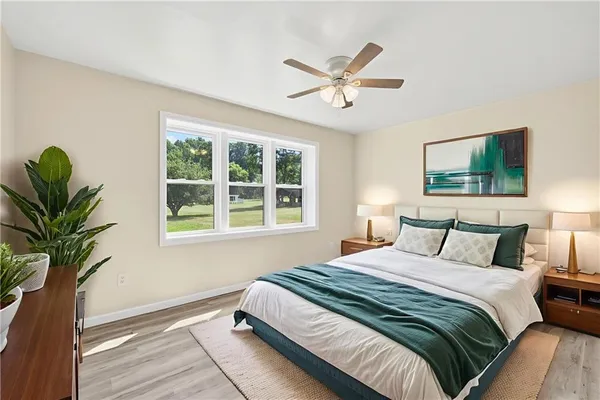 a bedroom with a large bed and a window
