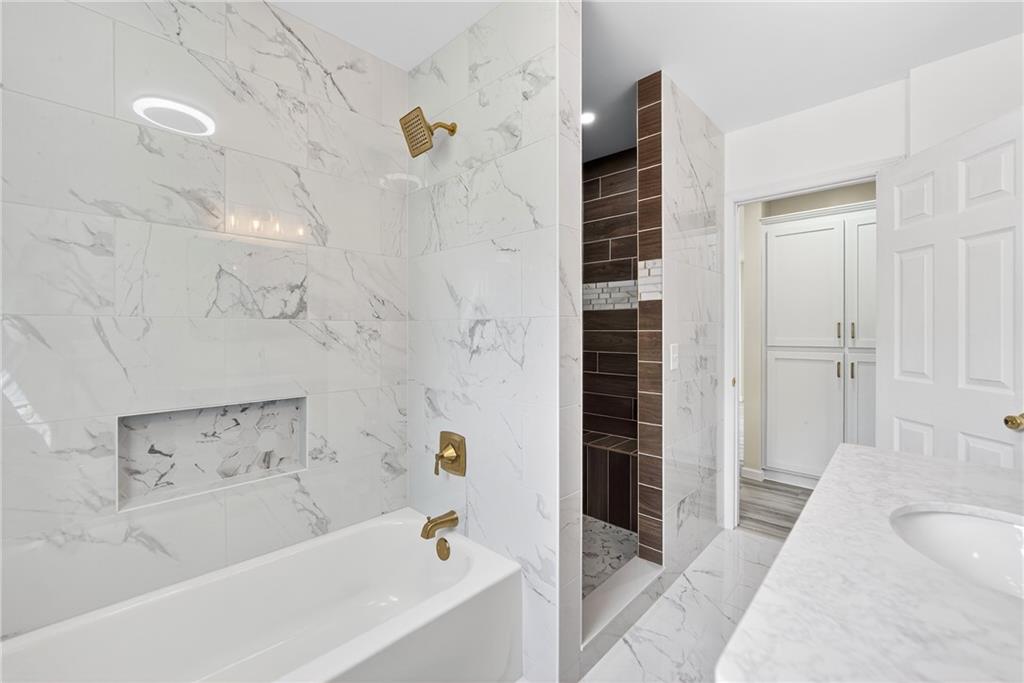 545 Vanderbilt Road Connellsville, PA 15425 - Photo 22 of 49 a bathroom with a bathtub and shower