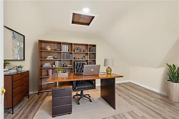 a view of a workspace with furniture